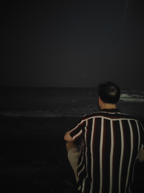 Robert Kozak looking out over the sea in the evening