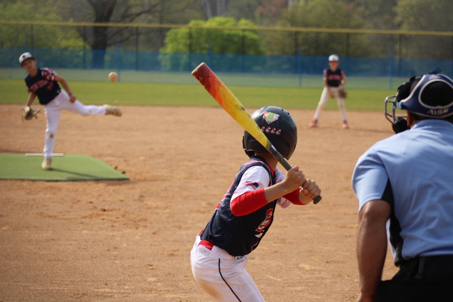 Youth baseball tournament action for Top Gun Sports